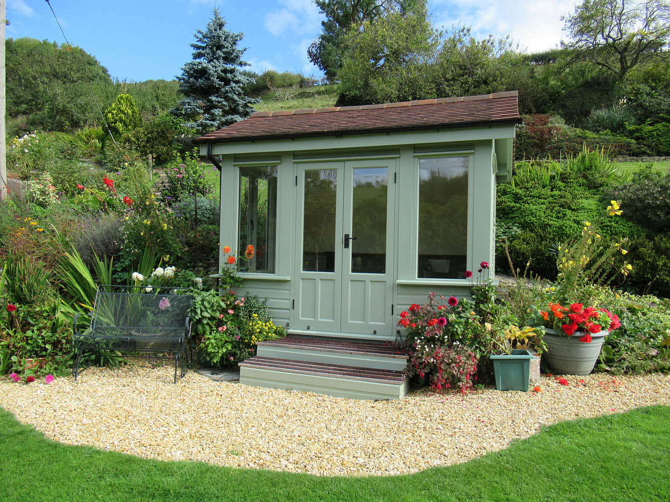 Painted bespoke insulated garden room with steps, Shropshire